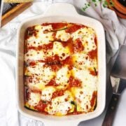 Italian baked zucchini in pan on a table.