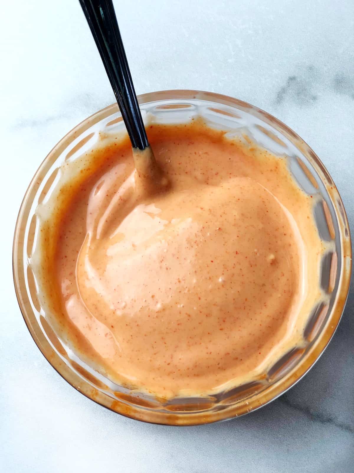 gochujang spicy mayo in bowl with a spoon