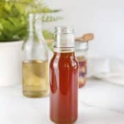 honey simple syrup in containers on a table