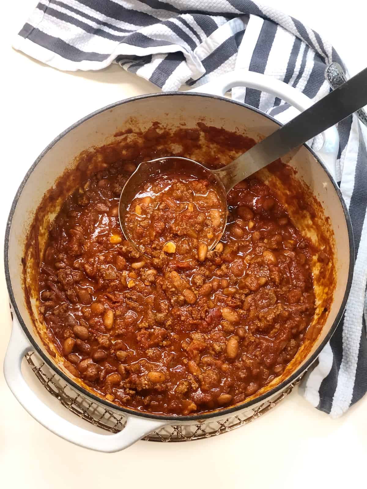Dutch oven chili in a large Dutch oven on the counter.