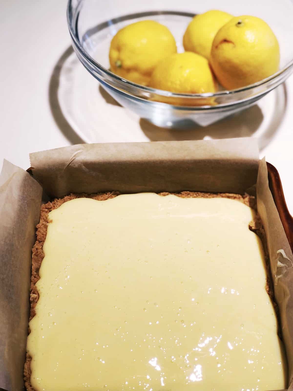 Adding creamy filling to crust.