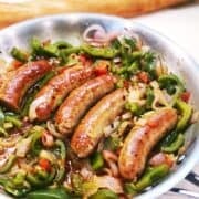 Italian sausage and peppers in a pan closeup.