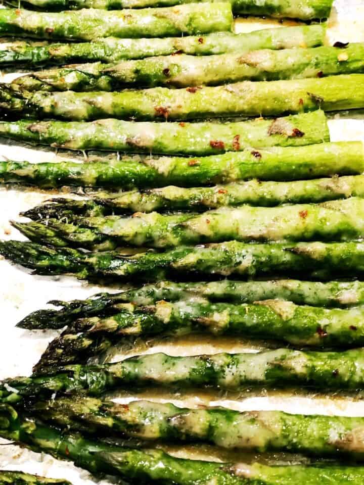 Garlic roasted Parmesan asparagus closeup in the pan.